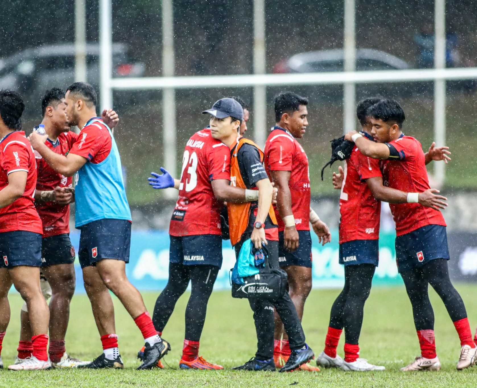 rugby team hug